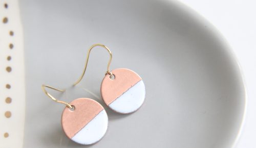 White and Copper Disc earrings on grey bowl